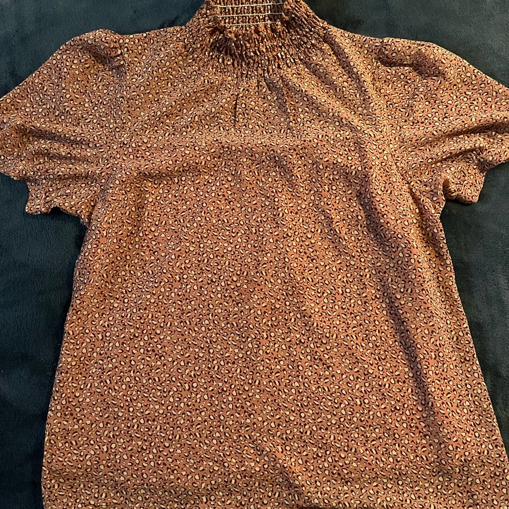 Women’s flowing top with animal print pattern